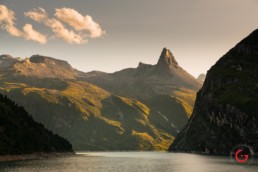 Travel Photographer Sunset from Zervreilasee Dam Looking Over the Water Into the Swiss Mountains and Zervreila