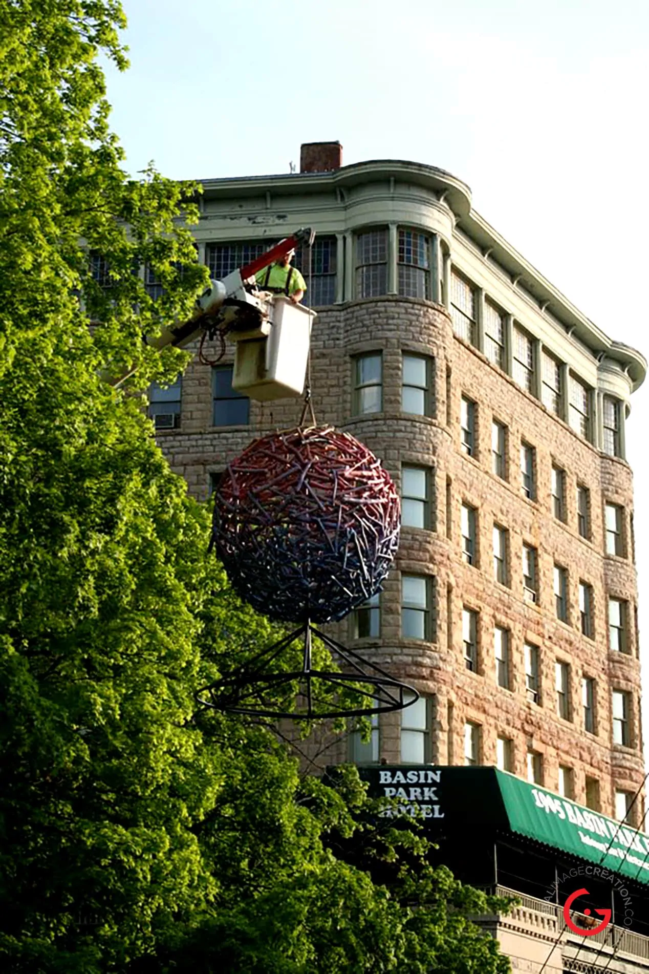 The Sphere Sculpture Gets Hoisted Into Position in Basin Park
