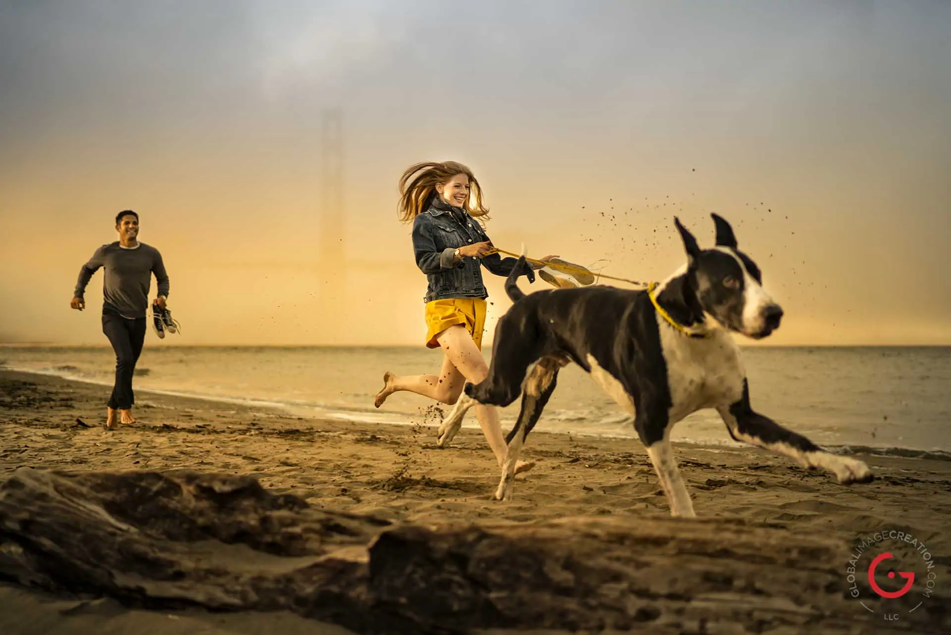 Couple Runs on Beach with Dog in San Fransisco - Photographer Lifestyle Photography Wardrobe Stylist