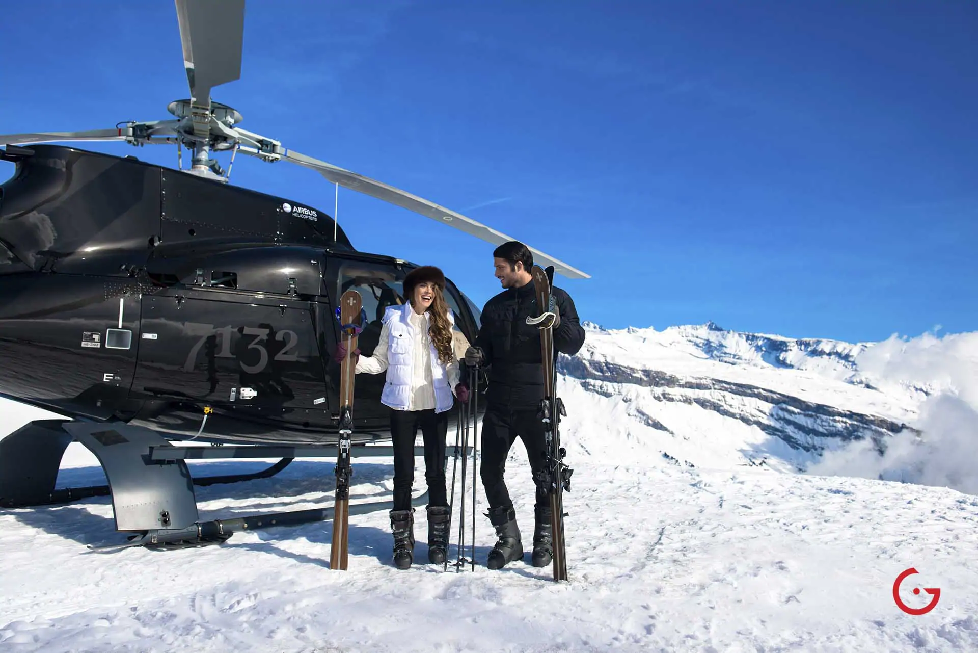 Couple arrives for ski trip in private helicopter - Professional Photographer Lifestyle Photography Wardrobe Stylist