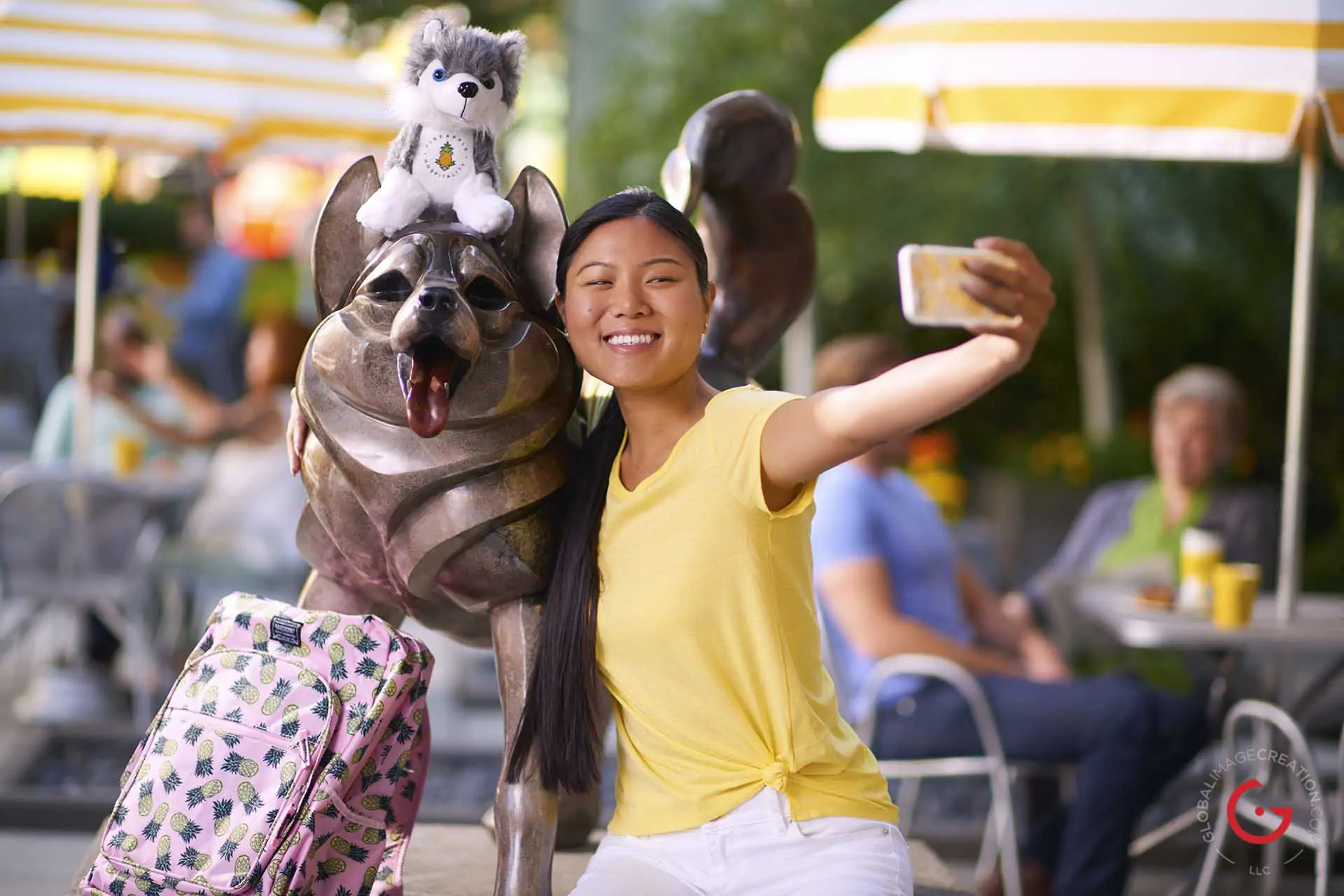 Girl shoots selfie with dog statue and stuffed animal - Professional Photographer Lifestyle Photography Wardrobe Stylist