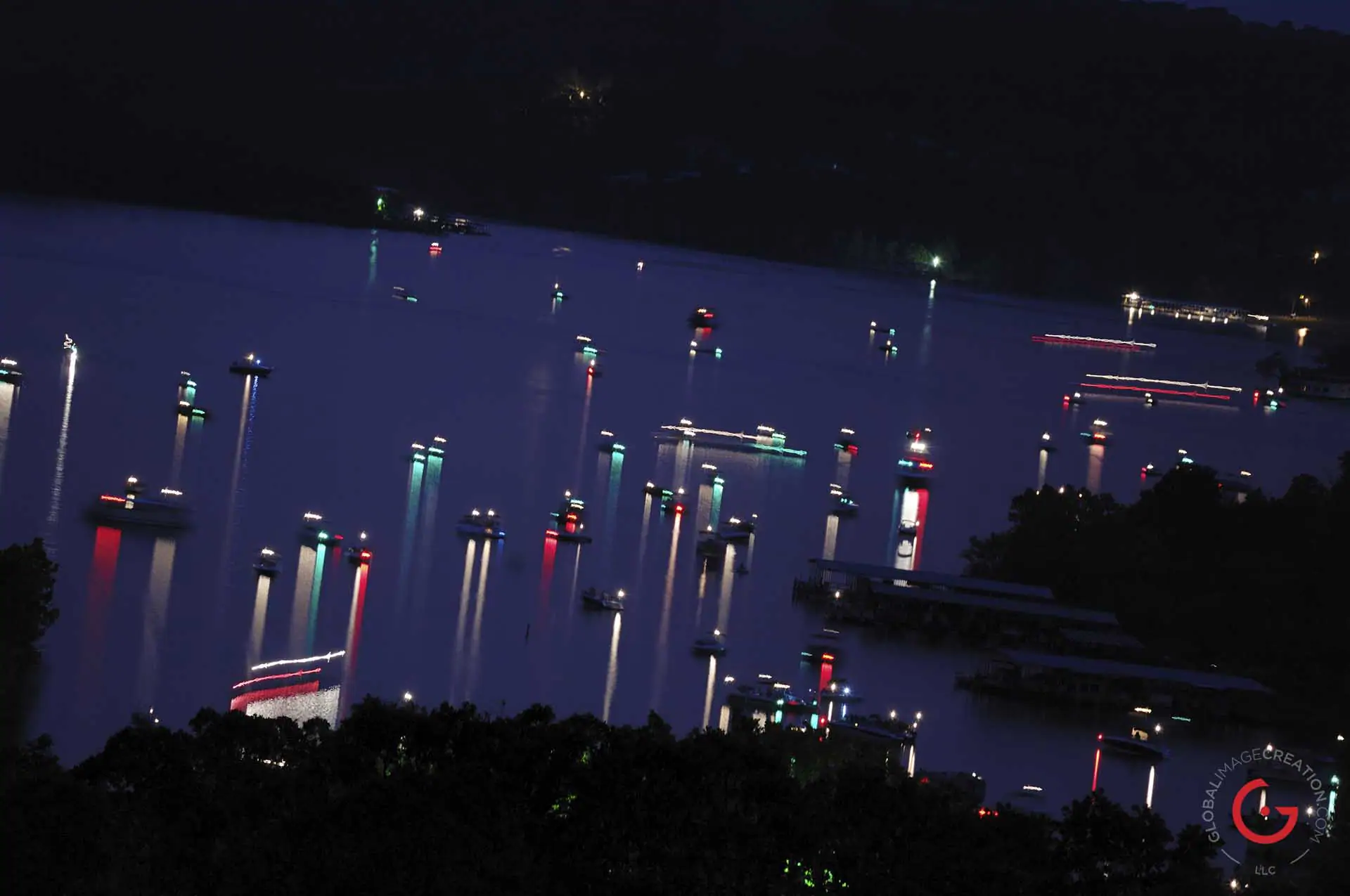 Lit up boats on table rock lake at night. - Advertising photographers in Branson Missouri, Branson Missouri photography