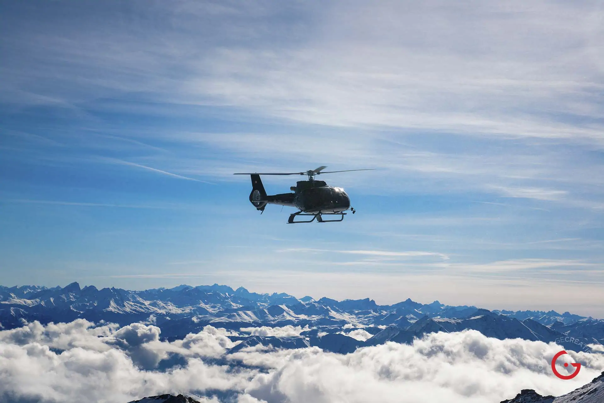 A Private Helicopter Hovers Over The Snow Covered Swiss Alps - Travel Photographer and Switzerland Photography