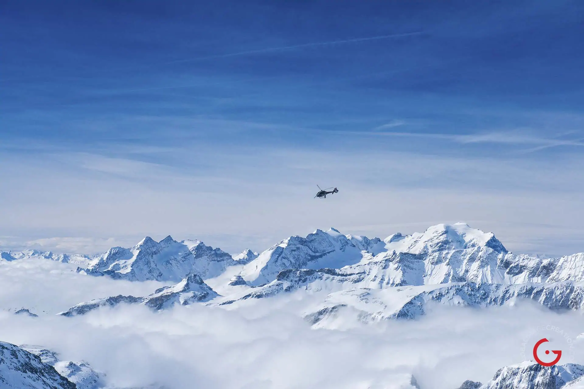 A Private Helicopter Hovers Over The Snow Covered Swiss Alps - Travel Photographer and Switzerland Photography