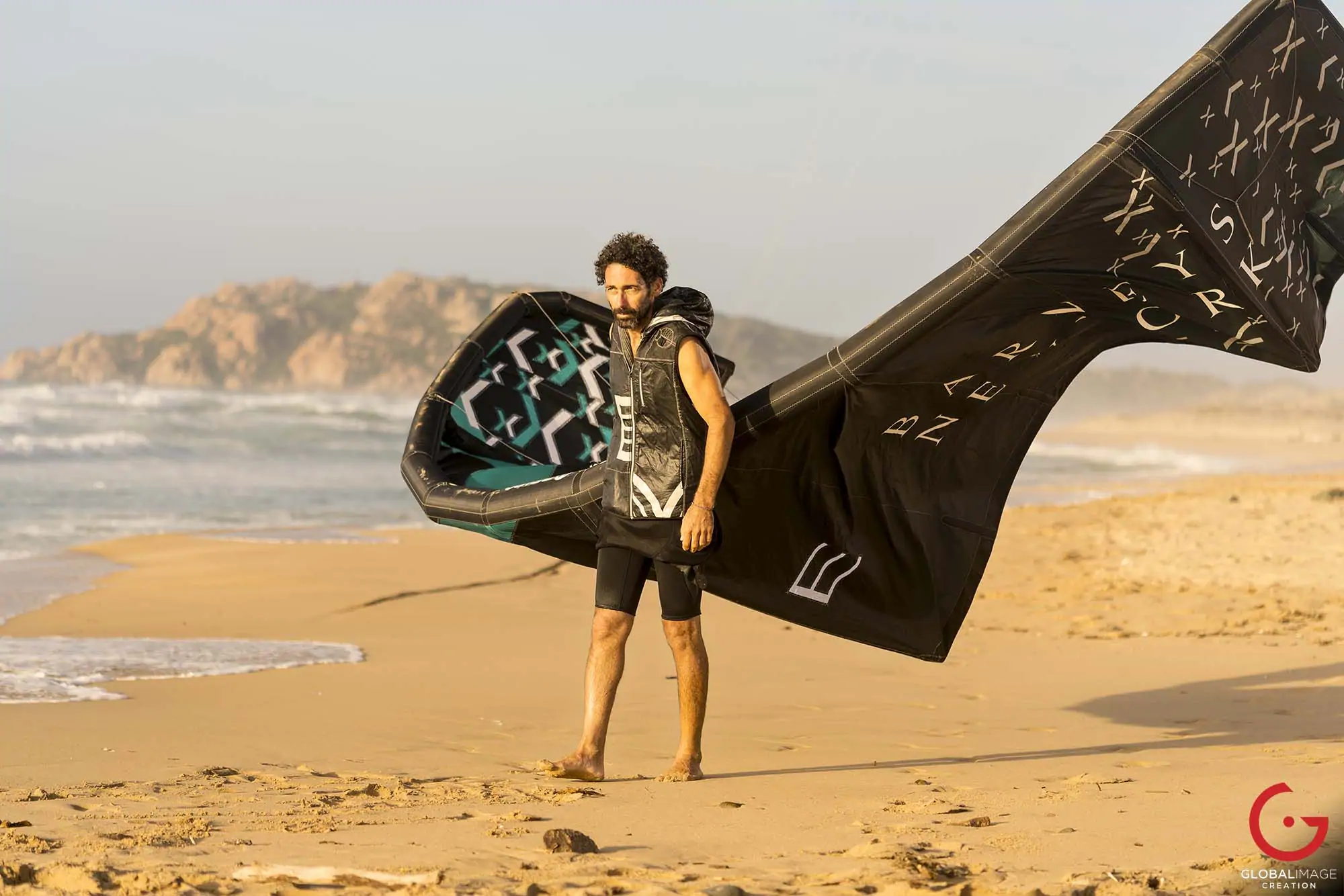 Kitesurfer Renzo Mancini Walks on the Beach With His Kite